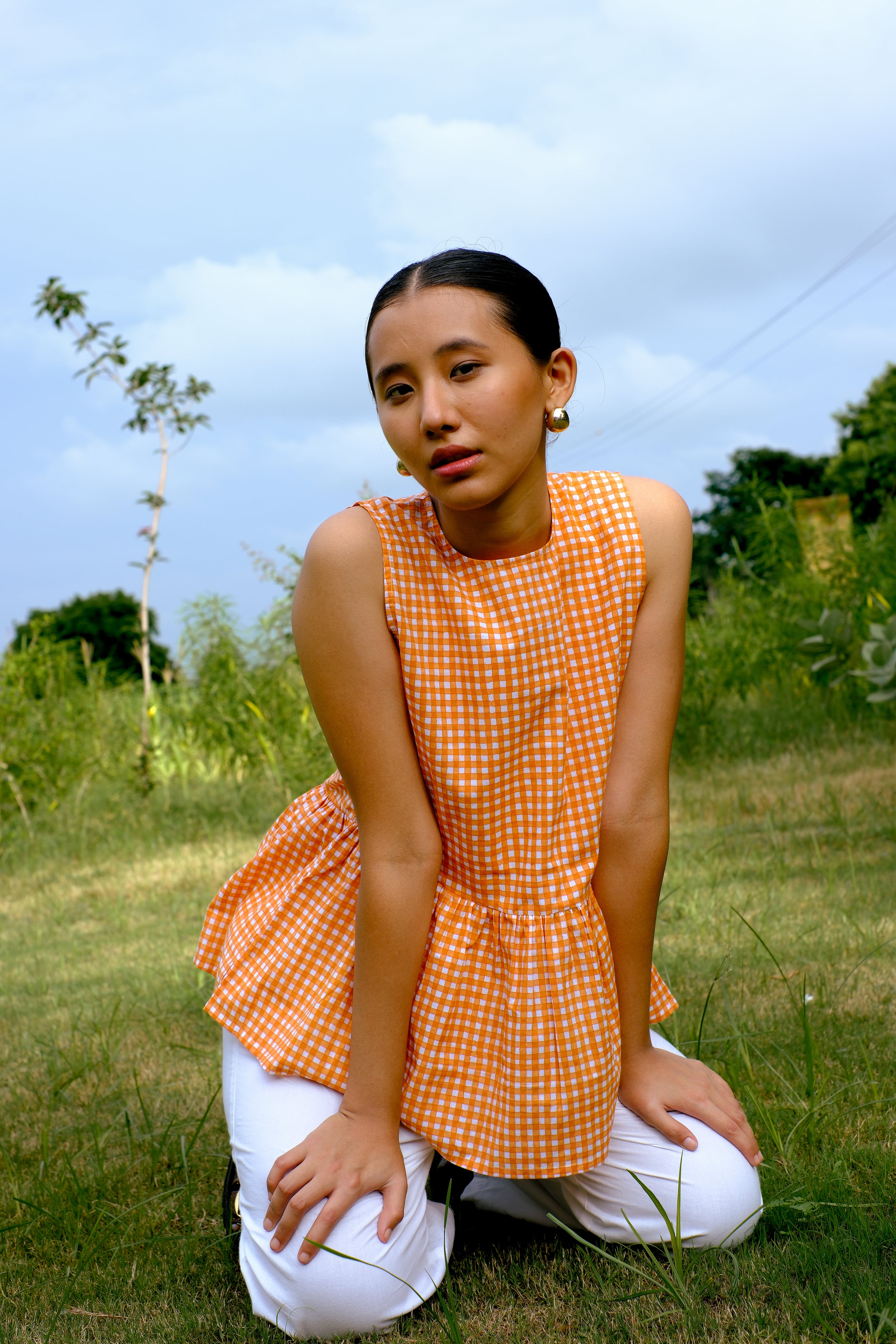 orange peplum sleeveless top